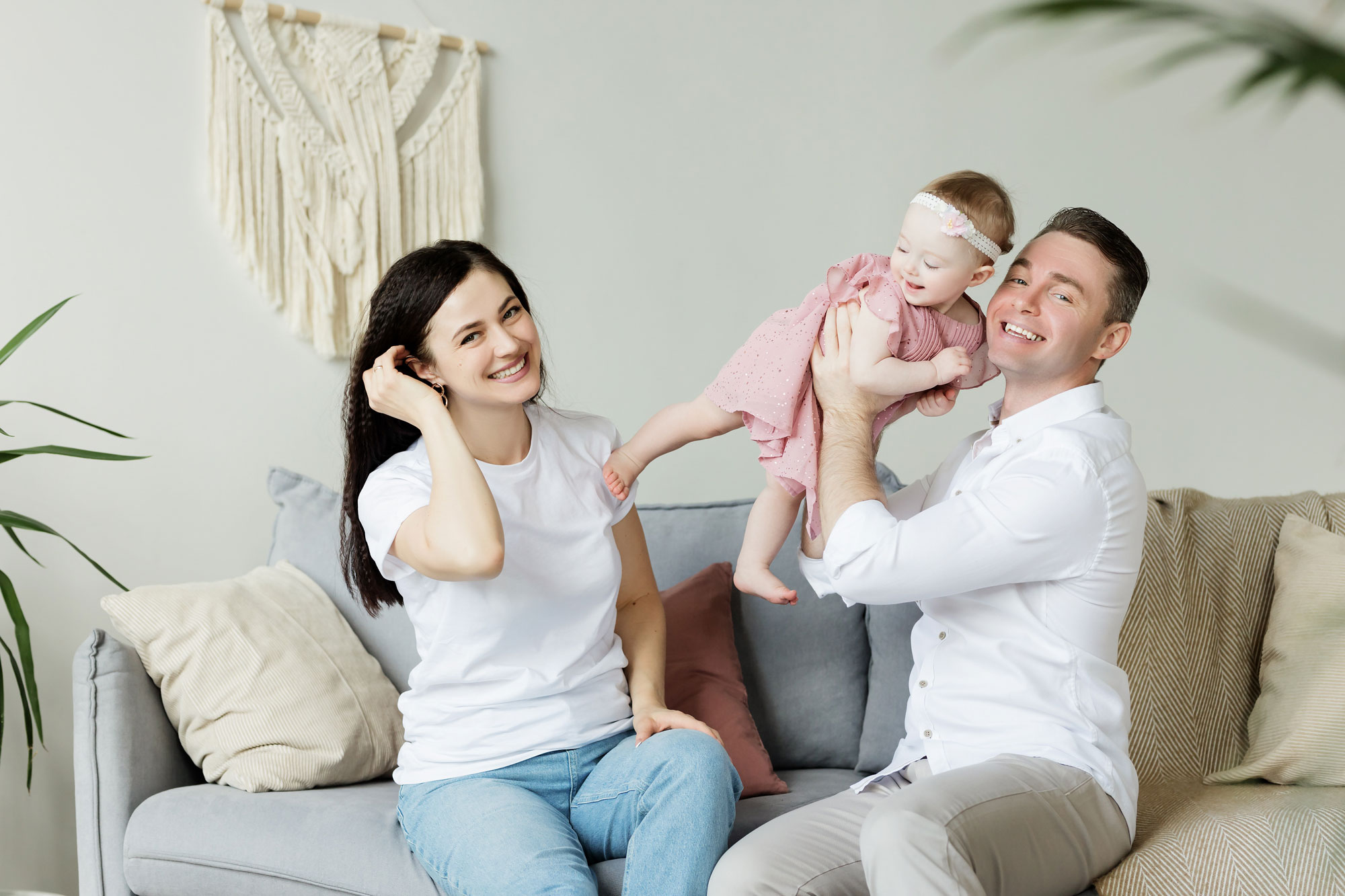 family sitting on couch