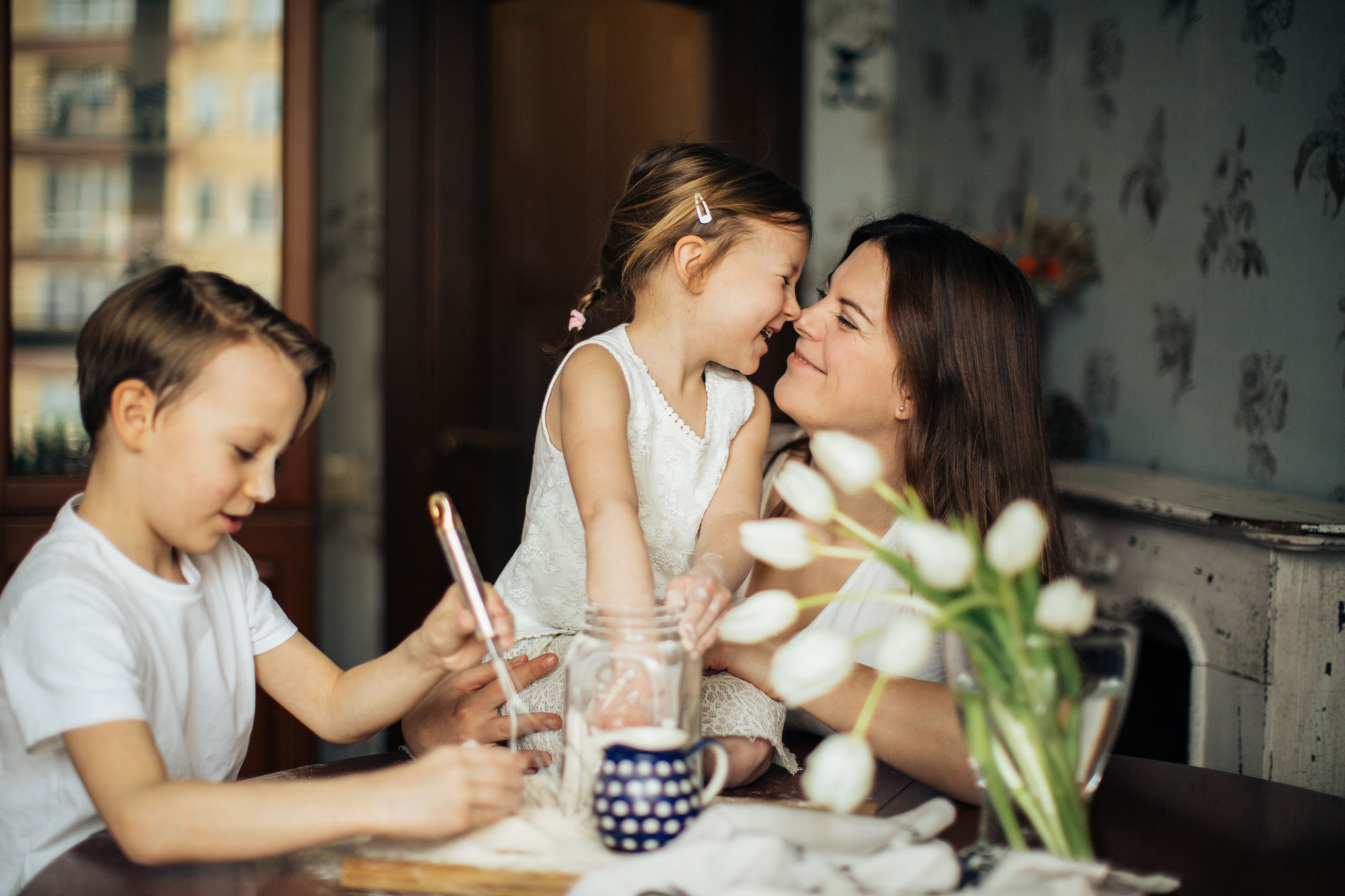 mother and children at table